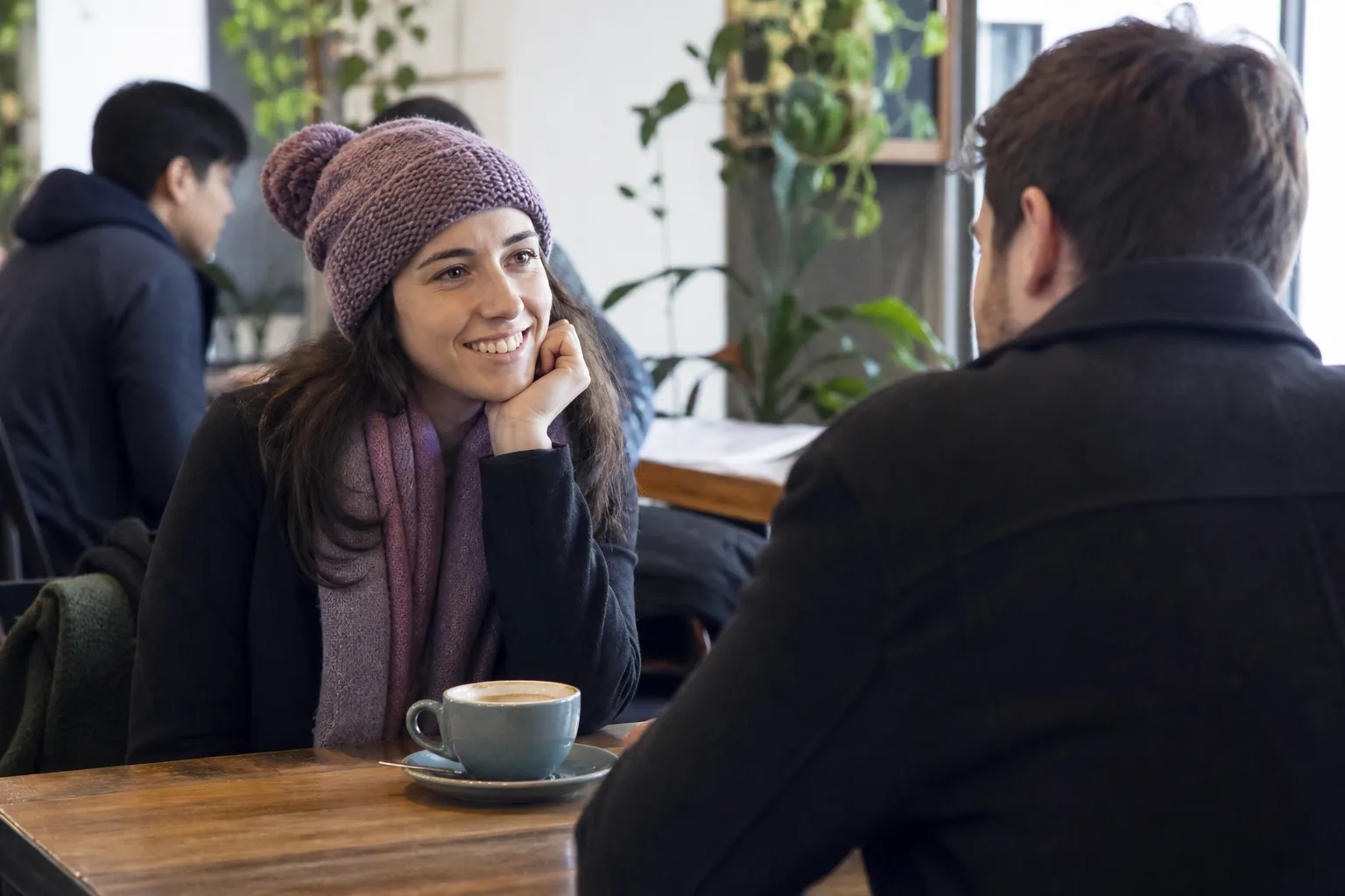 Two people meeting for coffee in a busy Grampian town centre